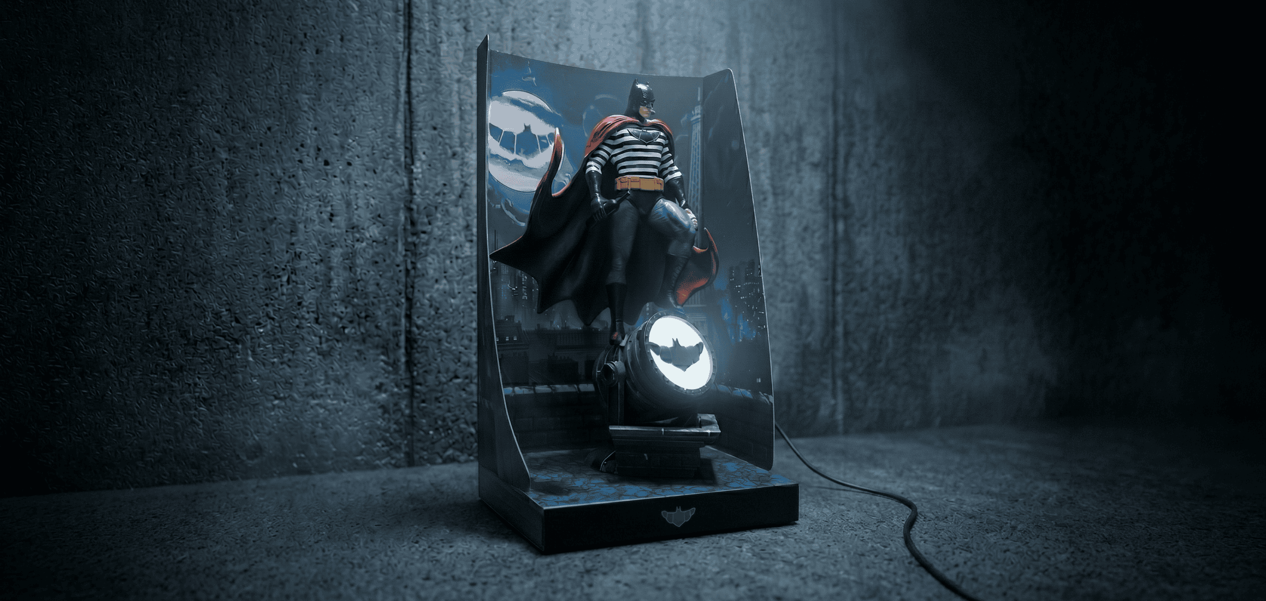 Johnnycola Ze Batman collectible figure with Bat-Signal display for fans and collectors.